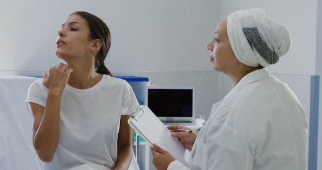 Female Doctor Examining Woman's Neck during Medical Appointment - Download Free Stock Images Pikwizard.com