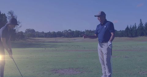 Senior Couple Enjoying Golf on Serene Golf Course at Sunset