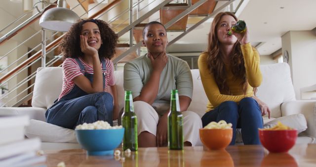 Friends Enjoying Movie Night With Snacks and Drinks in Living Room - Download Free Stock Images Pikwizard.com