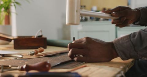 Artisan Crafting Leather with Hand Tools in Workshop Setting - Download Free Stock Images Pikwizard.com