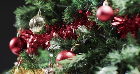 Festive Close-Up of Christmas Tree with Ornaments - Download Free Stock Images Pikwizard.com