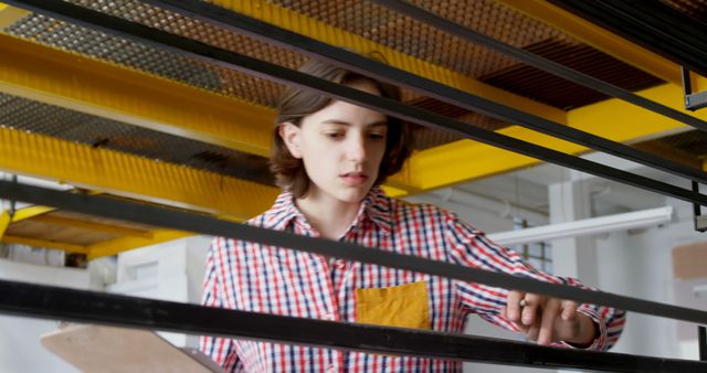 Warehouse Worker Inspecting Metal Racks - Download Free Stock Images Pikwizard.com