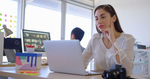 Confident Young Professional Woman Working on Laptop in Modern Office - Download Free Stock Images Pikwizard.com