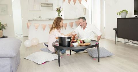 Romantic Indoor Picnic with Mature Couple Enjoying Wine