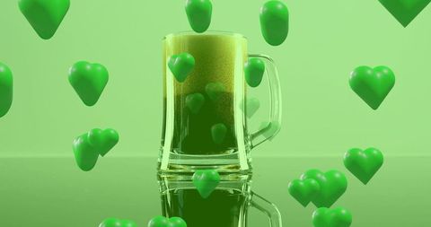 Emerald st patrick beer mug with floating heart bubbles on glossy reflective surface