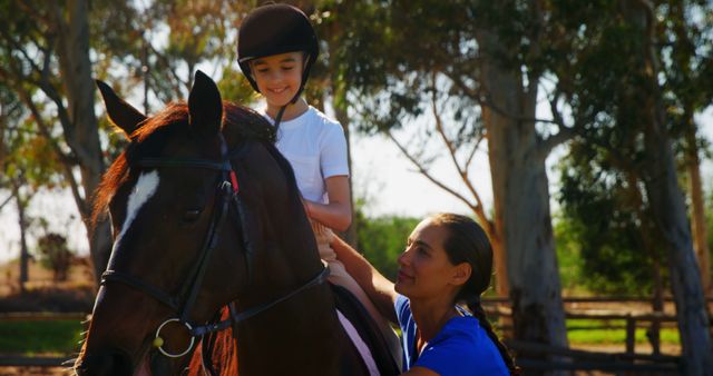 Instructor Guiding Young Girl Learning Horseback Riding Outdoors - Download Free Stock Images Pikwizard.com