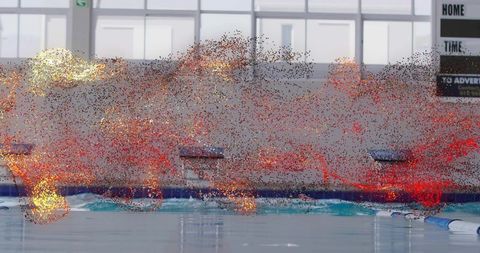 Competition swimming pool with starting blocks, lane markers and red particle overlay