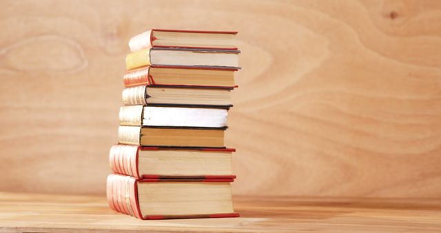 Stack of Old Books on Wooden Surface with Blurred Wood Background - Download Free Stock Images Pikwizard.com