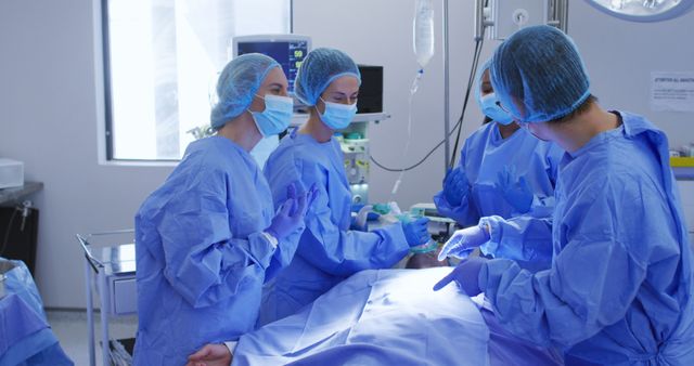 Highly skilled surgeons collaborating during an operation. Suitable for articles, brochures, or websites about medical procedures, healthcare teamwork, hospital environments, or patient care scenarios.
