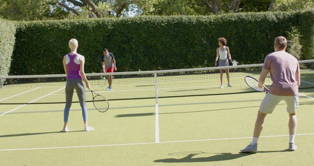 Diverse Group Playing Tennis on Outdoor Court - Download Free Stock Images Pikwizard.com