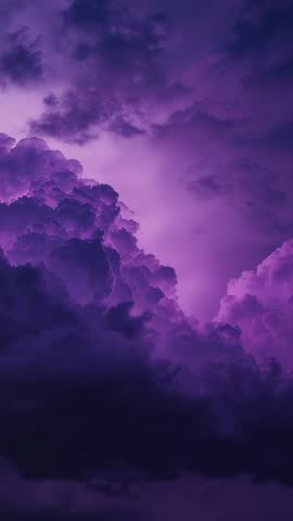 Vertical storm footage showing purple cumulonimbus cloud glowing with internal lightning