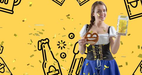 Woman in dirndl holding beer and pretzel celebrating oktoberfest