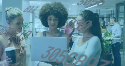 Three Women Collaborating on Laptop in Open Office with Transparent Numeric Overlay