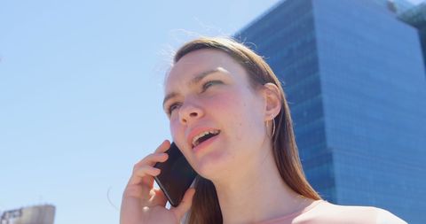 Caucasian Businesswoman Talking on Phone in Urban Setting - Download Free Stock Images Pikwizard.com