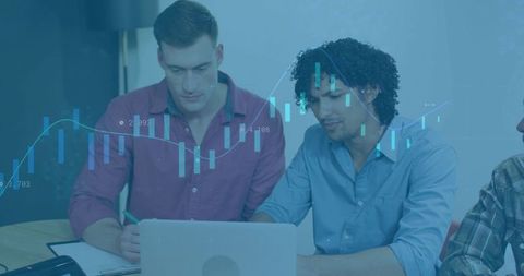 Coworkers Analyzing Financial Trends in Modern Office