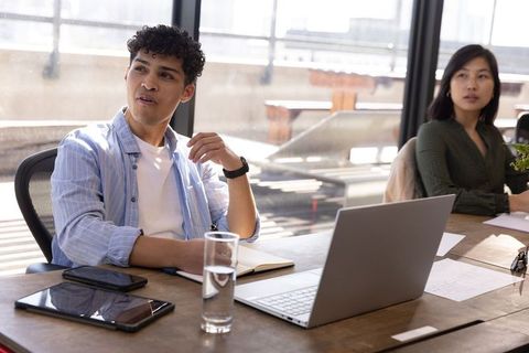 Diverse team discussing strategy in modern office environment