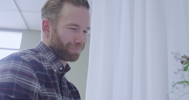 Smiling Man with Beard Working in Modern Office - Download Free Stock Images Pikwizard.com