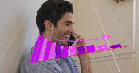 Man Talking on Smartphone Amid Digital Graphical Display