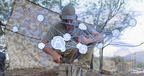 Outdoor Enthusiast Chopping Wood with Technology Network Overlay