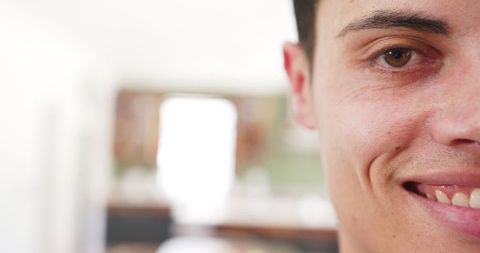 Half Portrait of Smiling Man in Modern Living Room