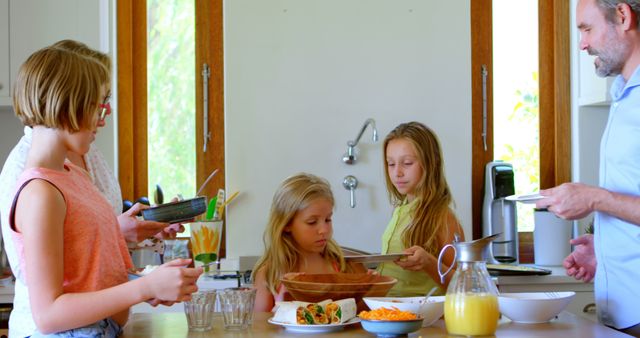 Family Gathering at Kitchen Table for Breakfast - Download Free Stock Images Pikwizard.com