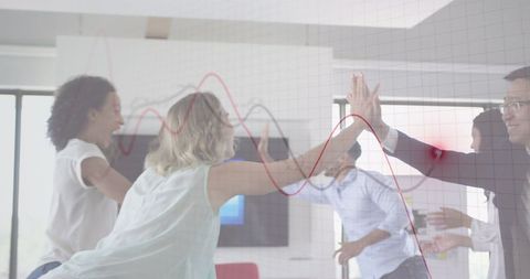 Diverse Team Celebrating Financial Success in Modern Office