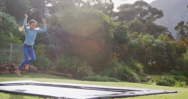 Young Girl Jumping on Trampoline in Backyard Garden - Download Free Stock Images Pikwizard.com