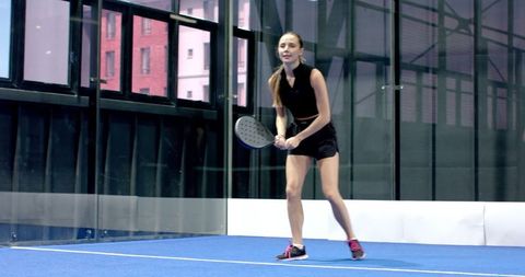Female Athlete Practicing Padel on Indoor Court