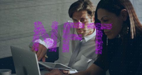 Business Team Analyzing Digital Assets at Office Desk