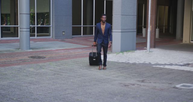 Confident Businessman Walking with Suitcase in Modern Urban Area - Download Free Stock Images Pikwizard.com