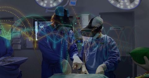 Surgeons performing mixed-reality surgery wearing vr headsets for precision collaboration