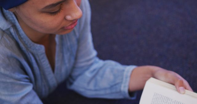 Young Woman Reading Book on Floor - Download Free Stock Images Pikwizard.com