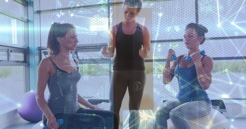 Personal Trainer Guiding Clients during Indoor Fitness Routine