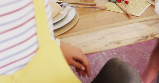 Child Preparing for Meal at Dining Table with Utensils and Plates - Download Free Stock Images Pikwizard.com