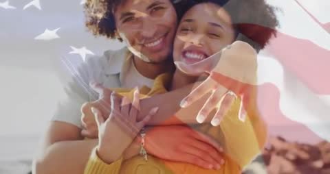 Romantic Couple Embracing by Ocean with Superimposed Star-Spangled Banner