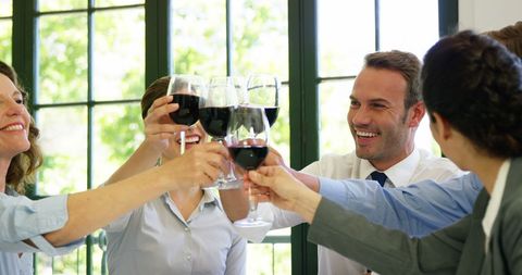 Business Team Cheers with Red Wine in Restaurant Gathering - Download Free Stock Images Pikwizard.com