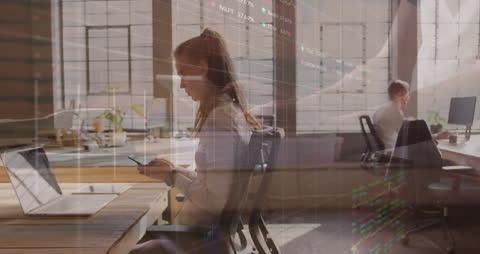 Businesswoman Analyzing Financial Data with Global Finance Animation Overlay