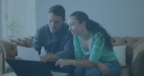 Caucasian Couple Analyzing Numbers on Laptop