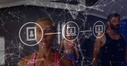Female Athlete Standing in Gym with Holographic Network Overlay Representing Fitness Data