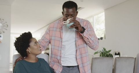 Couple Sharing Relaxing Moment with Tablet and Coffee in Cozy Living Room