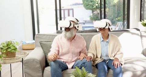 Senior Couple Enjoying Virtual Reality in Living Room