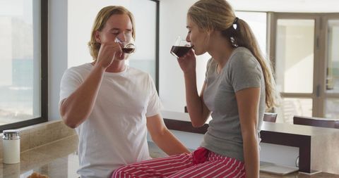 Young Couple Enjoying Morning Coffee in Modern Kitchen