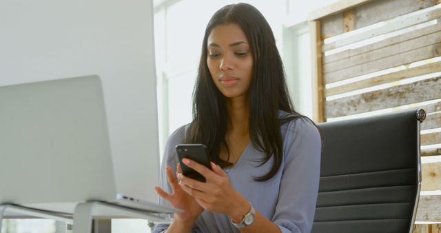 Woman Working on Smartphone at Modern Office Desk - Download Free Stock Images Pikwizard.com