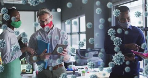Coworkers Collaborating in Modern Office with Safety Measures