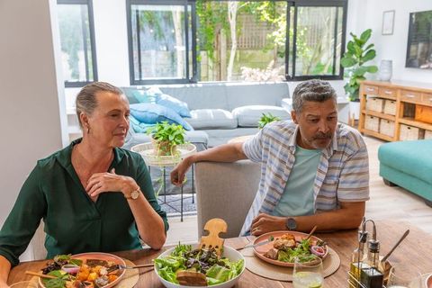 Senior Couple Enjoying Meal Together in Modern Home Interior