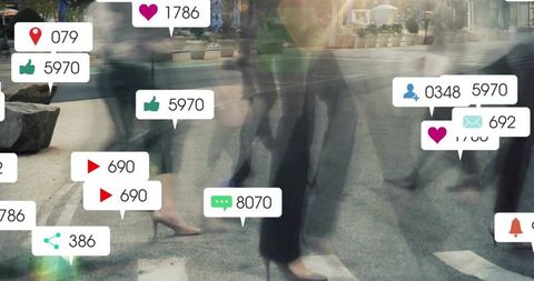 Blurred city pedestrians walking across crosswalk with social media notification overlays