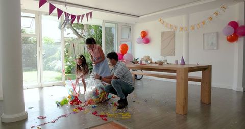 Family Celebrating Birthday at Home with Joy and Laughter
