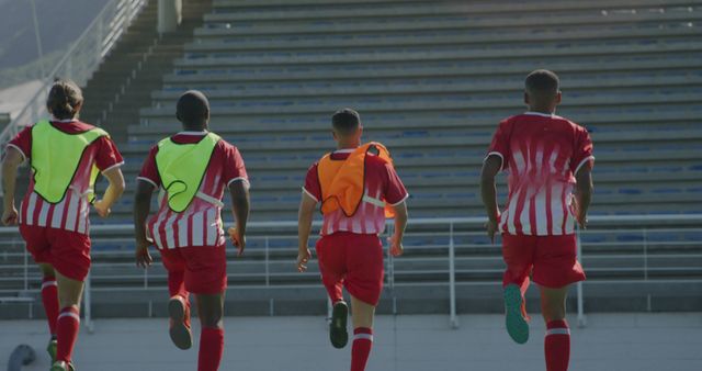 Soccer Players Running Toward Stadium Seats During Practice - Download Free Stock Images Pikwizard.com