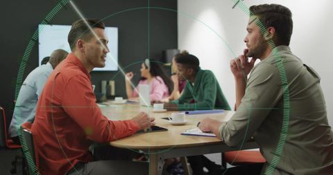 Business Team in Meeting with Overlaid Target Graphic