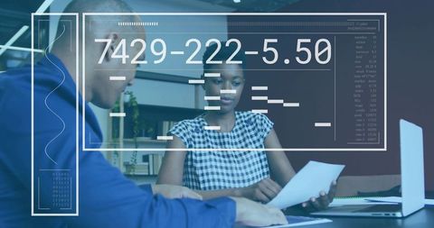 Colleagues reviewing financial report with futuristic hud overlay and data visualization